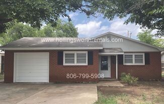 3 bedroom house with garage and storage shed