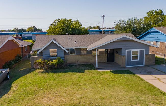 Beautifully Updated 4-Bedroom Home with Quartz Countertops and Spacious Backyard