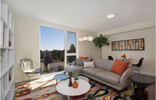 Large Open Spaced Living Room with floor to ceiling windows letting in natural light at Arabella Apartment Homes, Shoreline, Washington