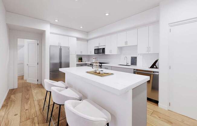 A modern kitchen with white countertops and bar stools at The Villas at Anacapa Canyon, Camarillo, 93012