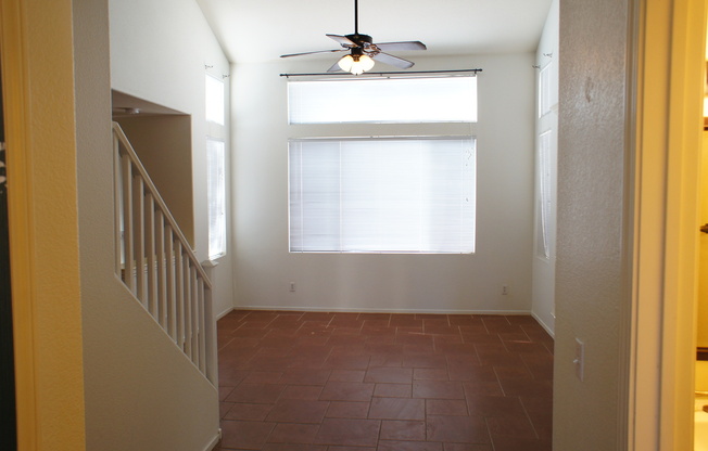 THIS IS A CHARMING TWO-STORY NORTH LAS VEGAS HOME WITH 2 BEDROOMS, 2.5 BATHS AND A TWO-CAR ATTACHED GARAGE. FEATURING TILE AND CARPET FLOORING, NEUTRAL PAINT, AND BLINDS THROUGHOUT, THE MAIN LEVEL OFFERS AN OPEN LIVING AND DINING AREA THAT FLOWS INTO A KI