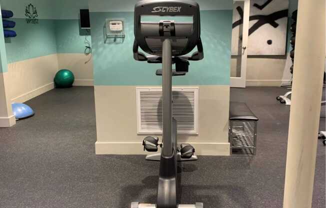 a workout room in a gym with a treadmill