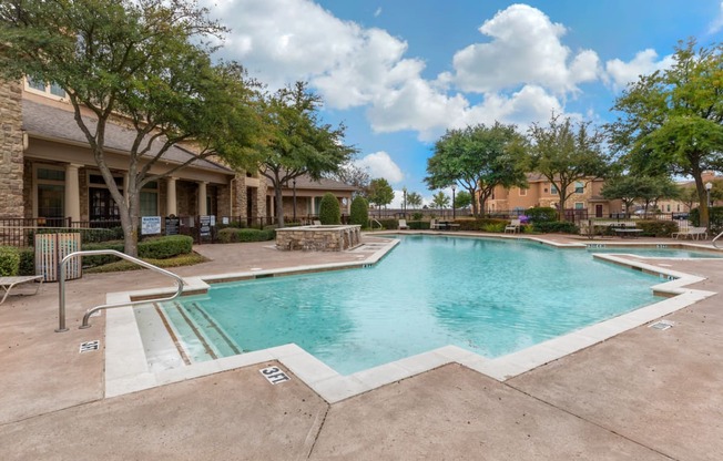 Swimming pool with lounge seating and community clubhouse