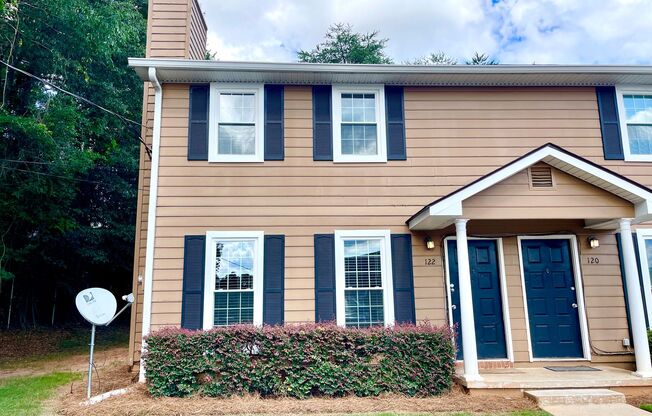 Welcome to this stylish and contemporary 2-bedroom, 1.5-bathroom corner townhome in Stockbridge!