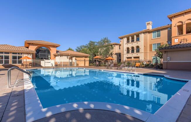 a blue pool of water in front of a building