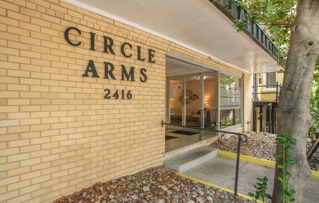 a brick building with the words arms on the side