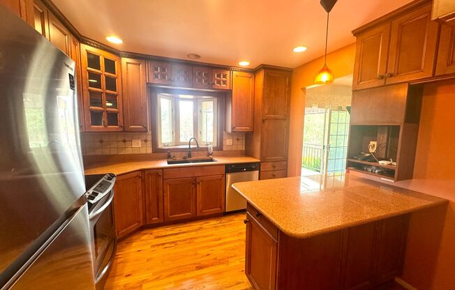 Spacious Eastside Home with Sunroom, EV Charging & Finished Basement!
