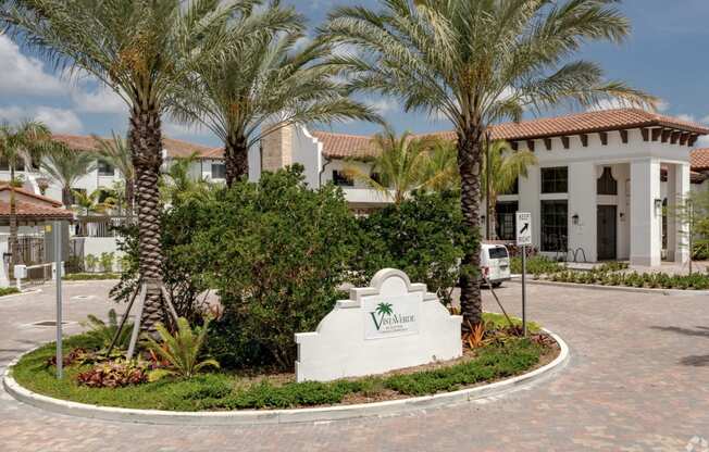 a building with palm trees in front of it