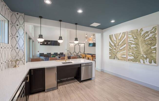 an open kitchen and living room with a counter top