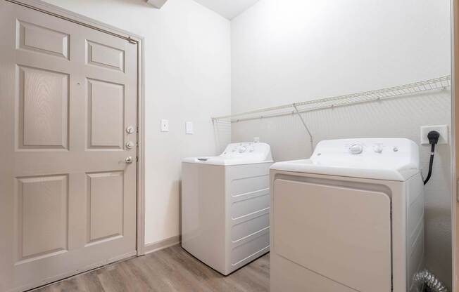 A laundry room with a washer and dryer.