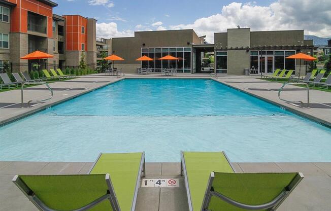 Umbrella Shaded Chairs By Pool at Lofts at 7800 Apartments, Midvale, UT, 84047
