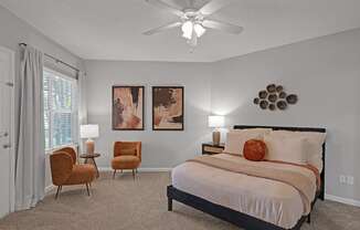 the preserve at ballantyne commons bedroom with bed and ceiling fan