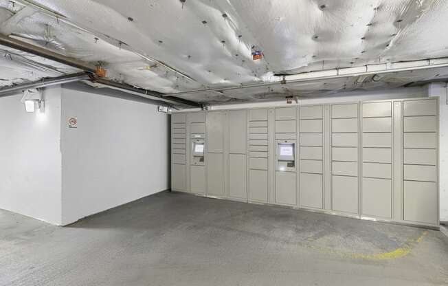 a large room with package receiving lockers  at King Arthurs Court, Seattle, 98125