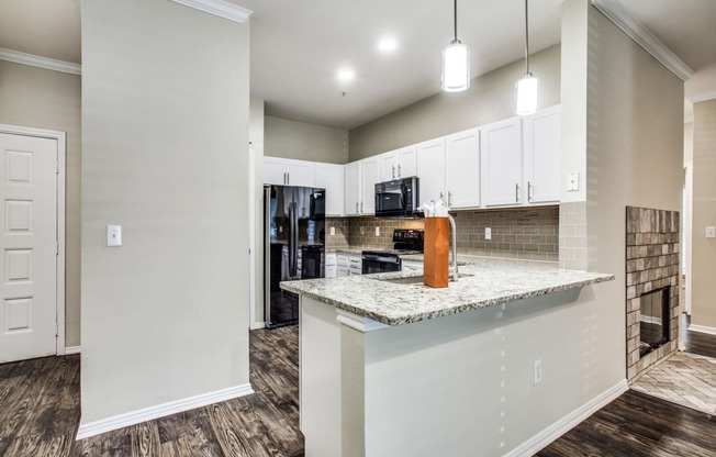 White shaker style cabinets and granite countertops available in some homes!