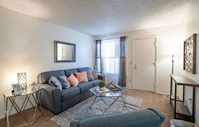 our apartments offer a living room with a couch and a coffee table