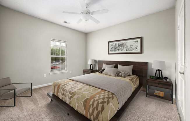 a bedroom with a bed and a ceiling fan