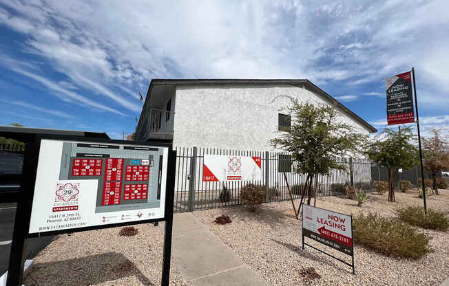 A sign for a fire station is displayed in front of a building.