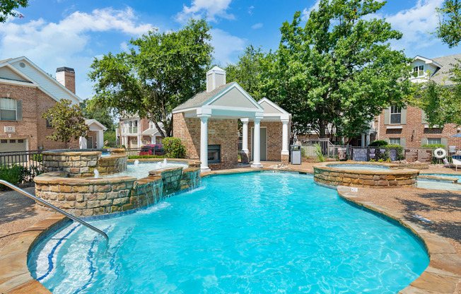 A pool with a gazebo in the middle of it.