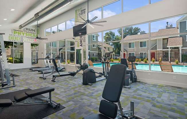 Community Fitness Center with Equipment at Broadmoor Village Apartments located in West Jordan, UT.