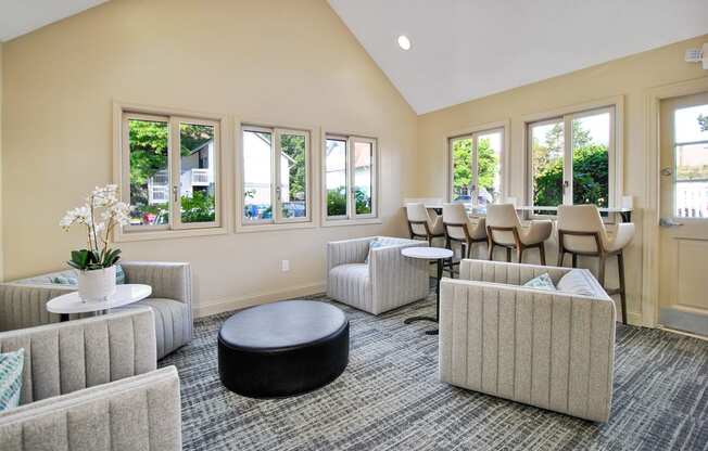 resident lounge with couches and chairs and tables