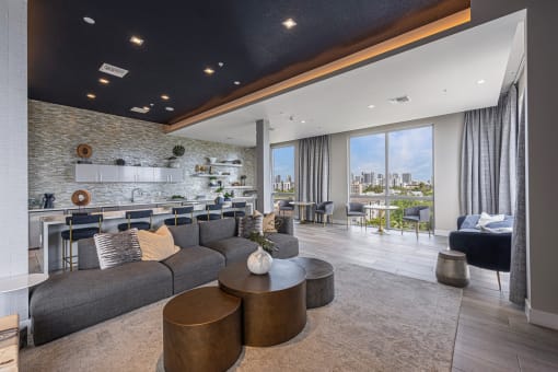 a living room with a gray couch and a table