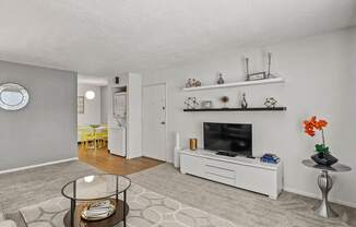 a living room with a couch and a tv