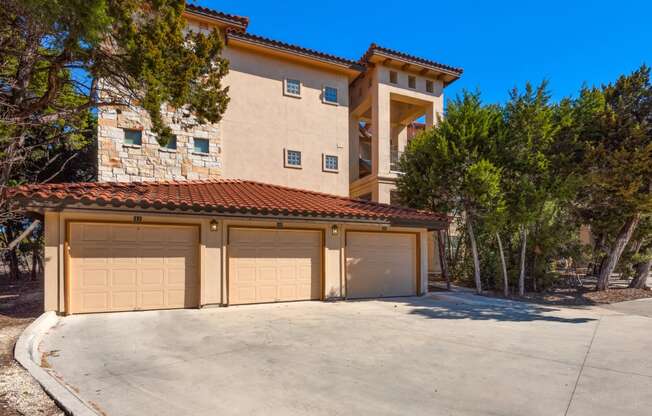 a garage with a two car garage door in front of a house