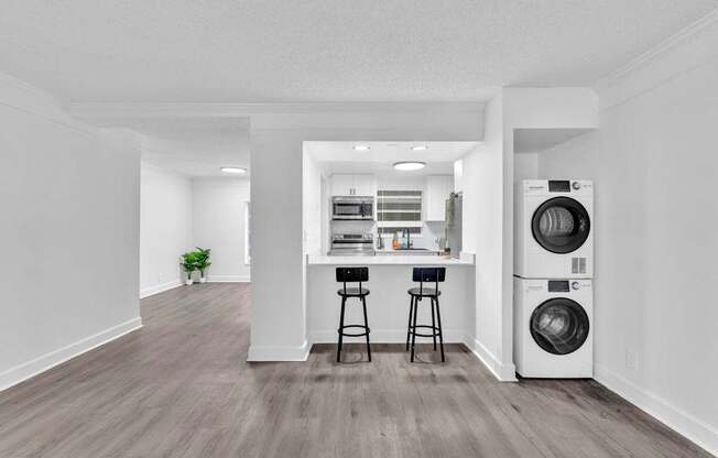 A laundry room with a washer and dryer.