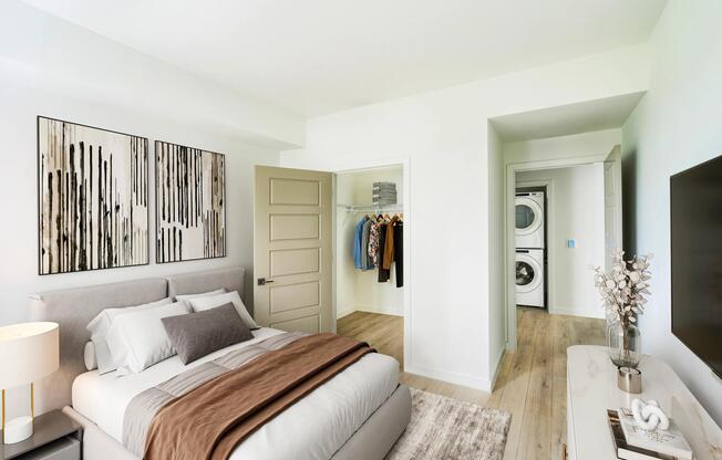 Natural light, neutral tones, and a spacious closet create a bedroom retreat that’s as functional as it is inviting at Modera Coral Springs North Tower.