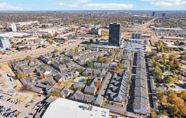 A cityscape with a mix of residential and commercial buildings.