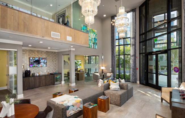 Resident lounge at our apartments for rent in Atlanta, featuring cushioned chairs and flat screen TV.