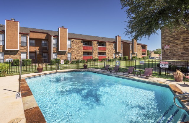 Apartments for Rent in Duncanville - Expansive Swimming Pool Surrounded by Various Lounge Chairs
