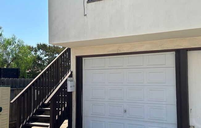 Upstairs 1 bedroom 1 bath unit with a one car garage included.