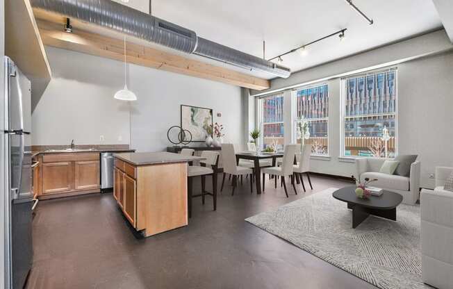 a living room with a kitchen and a dining room