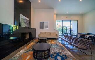 A living room with a fireplace and a couch.