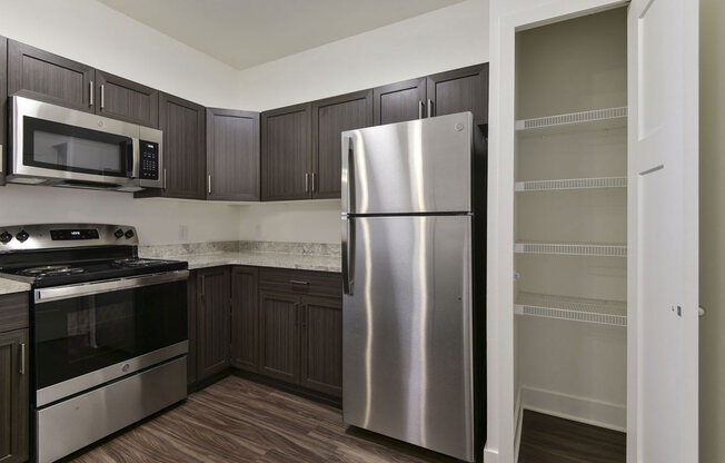 Built In Microwave and Pantry In Kitchen at Chase Creek Apartment Homes, Alabama, 35811