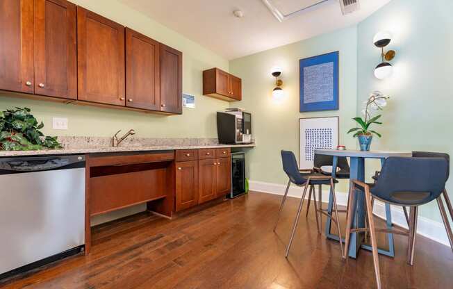 a kitchen and dining room with a table and chairs