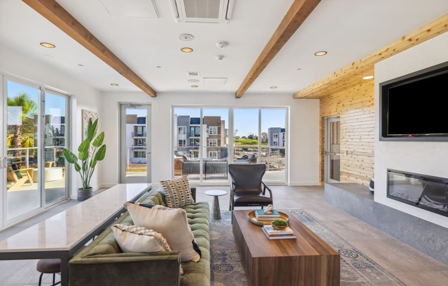 a living room with a couch and a coffee table and a television