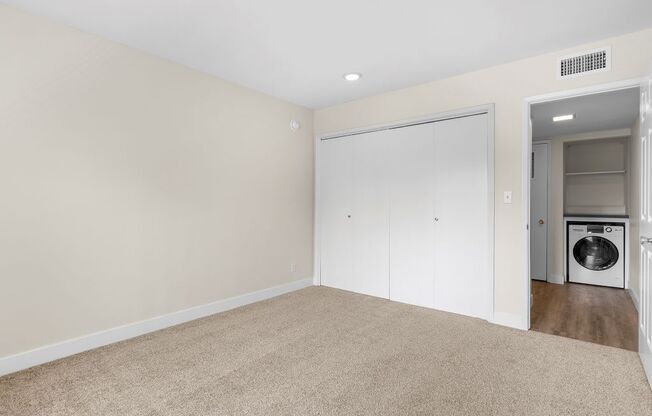 A laundry room with a washer and dryer.