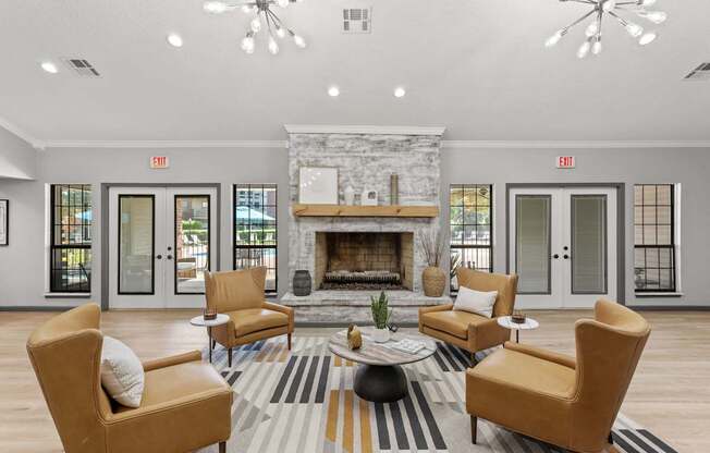 A living room with a fireplace and chairs.