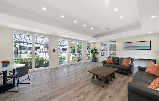 a living room with a couch and a table and chairs