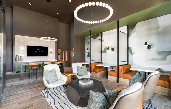 A refined coworking lounge with intimate seating, warm finishes, and space to gather or unwind.
