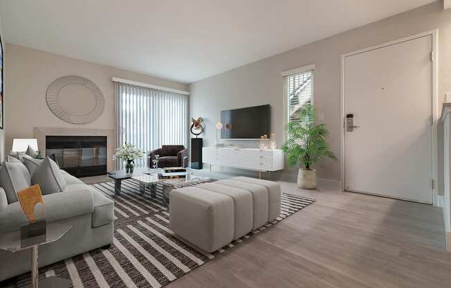 a living room with a fireplace and a tv on the wall  at Laguna Gardens Apts., California