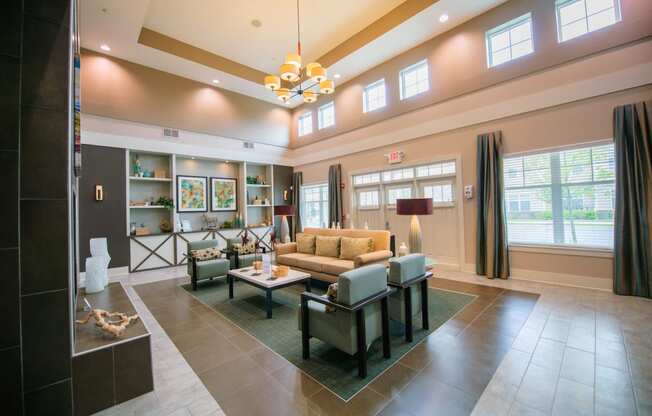 Clubhouse, large sofa, sofa chairs, fireplace, cathedral ceilings, large windows