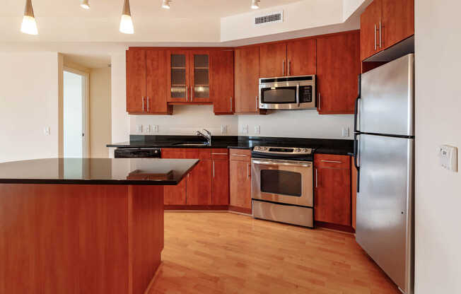 Kitchen with Cherry Wood Cabinets and Granite Countertops