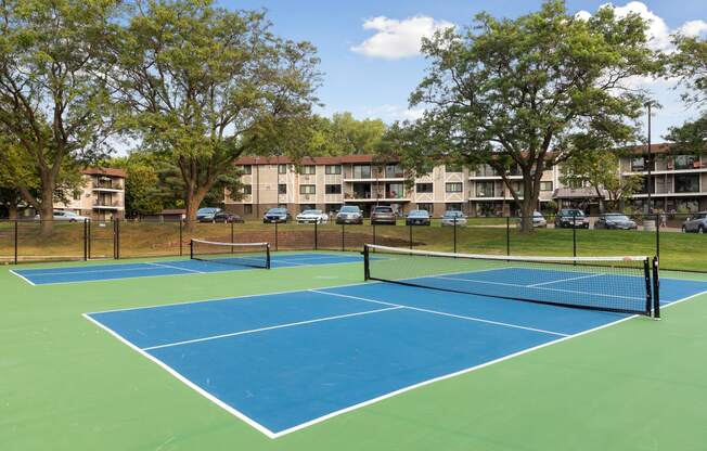 Play tennis at Villages on McKnight Apartments in St Paul