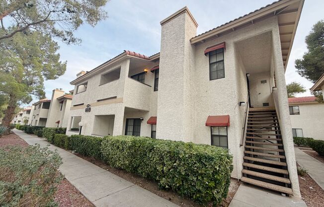 Centrally located beautiful second story condo in quiet community with vinyl plank flooring and beautiful custom showers!