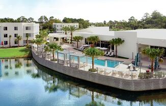 a resort with a swimming pool and a river at Icon One, Daytona Beach, FL, 32114