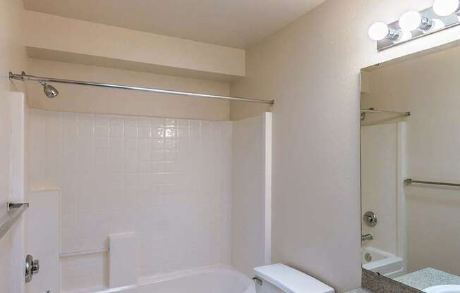 a bathroom with a sink toilet and a bath tub