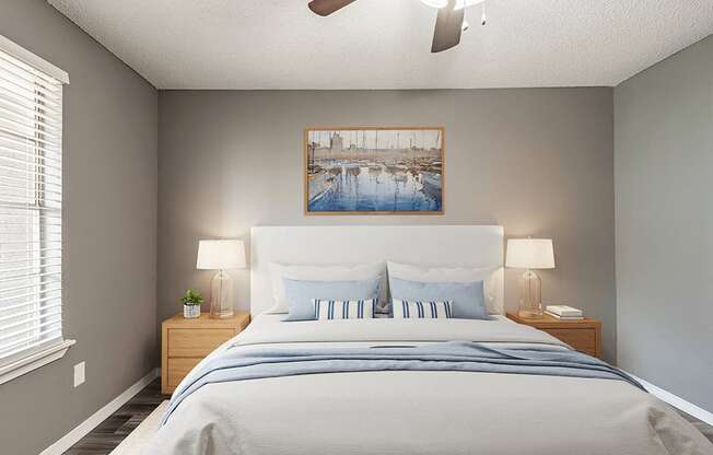 bedroom with ceiling fan, light, and window